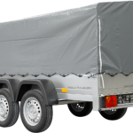 Unitrailer 264/2 Doppelachs-Kippanhänger mit Stützrad, Bügel und grauer Plane